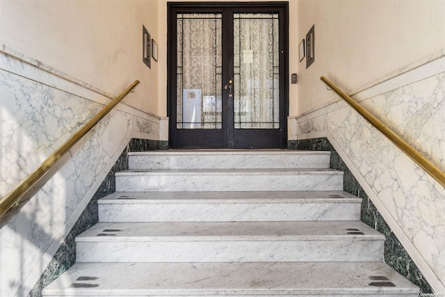 stairs with french doors