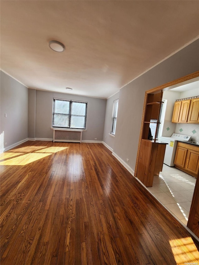 unfurnished living room with light hardwood / wood-style flooring