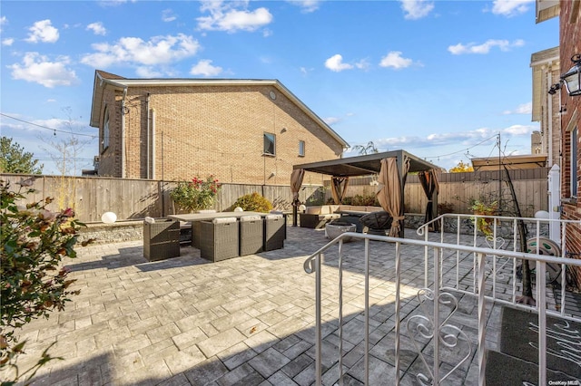 view of patio featuring a gazebo and an outdoor living space