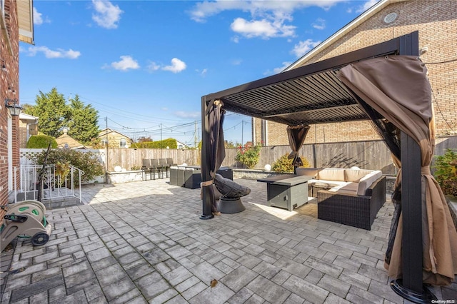 view of patio / terrace featuring an outdoor living space with a fire pit