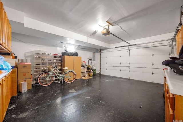 garage featuring electric panel and a garage door opener