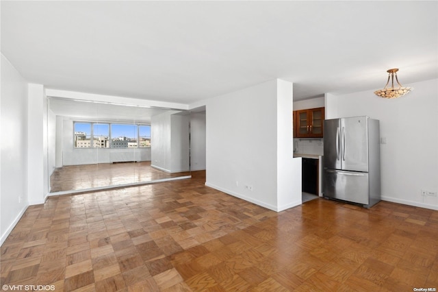 unfurnished living room with light parquet floors