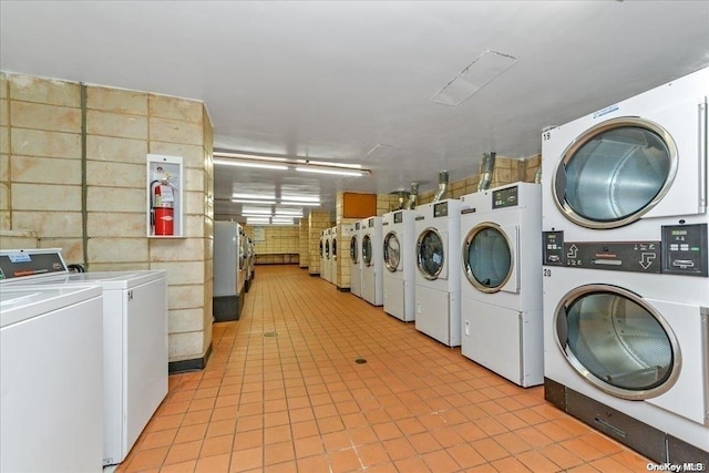 washroom featuring independent washer and dryer and stacked washer / dryer