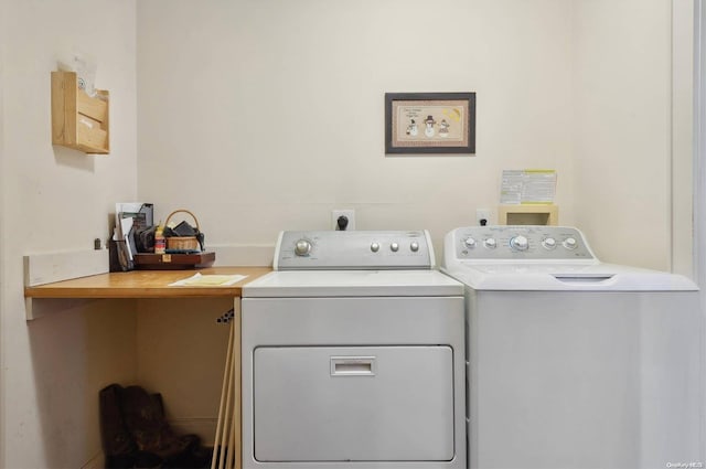 clothes washing area with independent washer and dryer