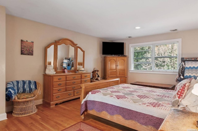 bedroom with light hardwood / wood-style floors