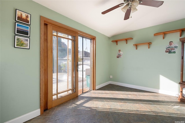 entryway with ceiling fan and lofted ceiling