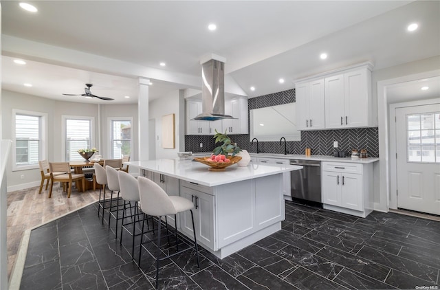 kitchen featuring dishwasher, ventilation hood, ceiling fan, tasteful backsplash, and white cabinetry