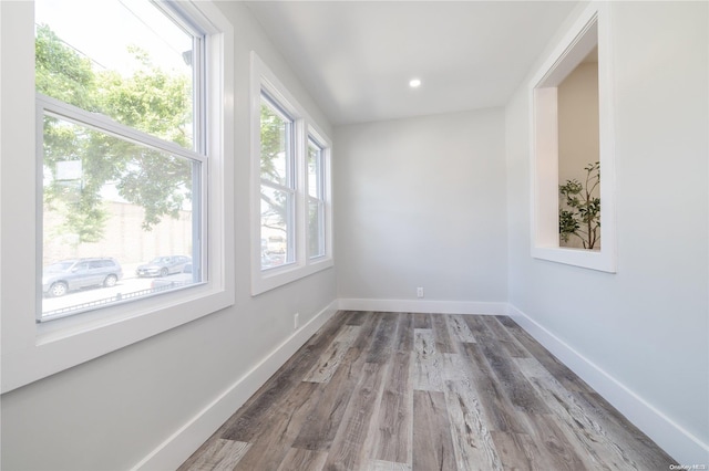 unfurnished room featuring hardwood / wood-style flooring