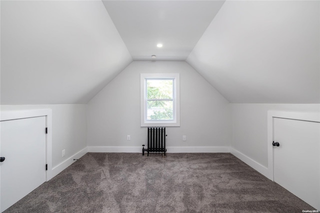 bonus room with radiator heating unit, carpet floors, and lofted ceiling