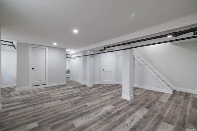 basement with light wood-type flooring and washer / clothes dryer