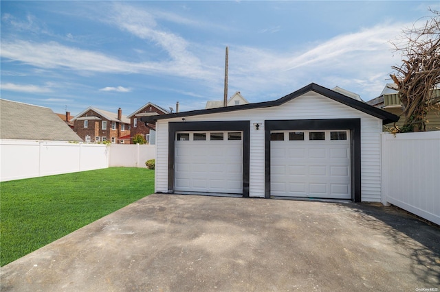 garage featuring a yard