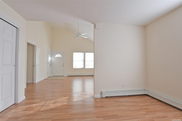 foyer with ceiling fan, high vaulted ceiling, a baseboard heating unit, and light wood-type flooring