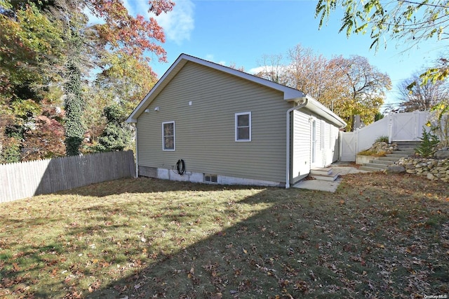 rear view of house with a yard