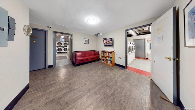 9707 4th Ave Unit 4G, Brooklyn, NY 11209 - sitting room featuring wood finished floors and stacked washer / drying machine