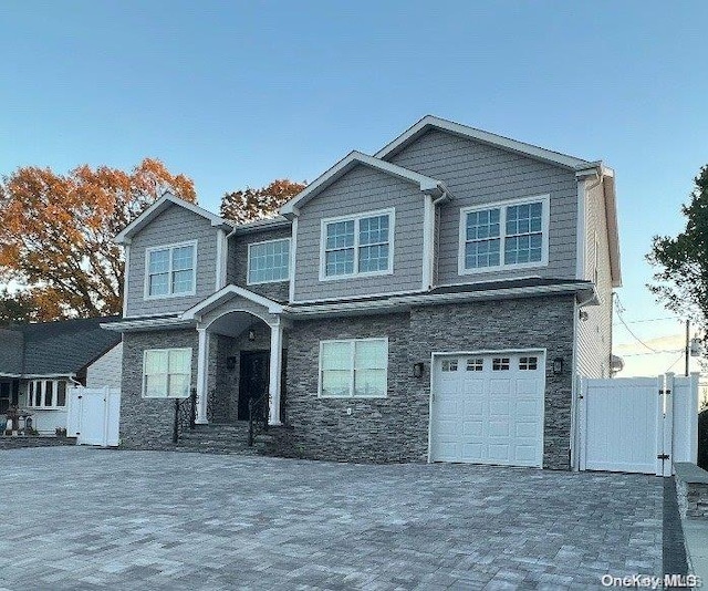 view of front of property with a garage