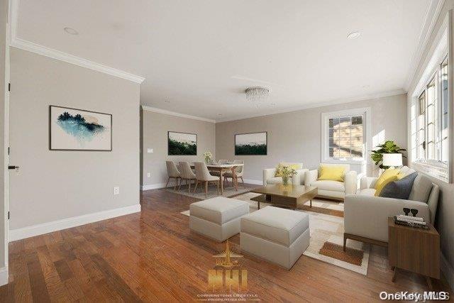 living room featuring hardwood / wood-style floors and crown molding