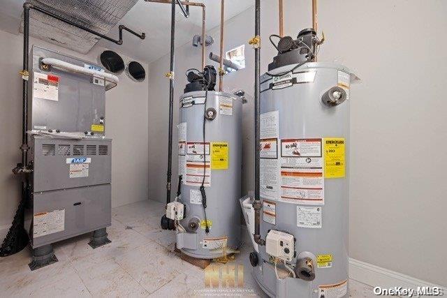 utility room with heating unit and gas water heater