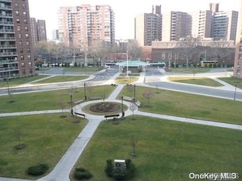 view of property's community with a lawn