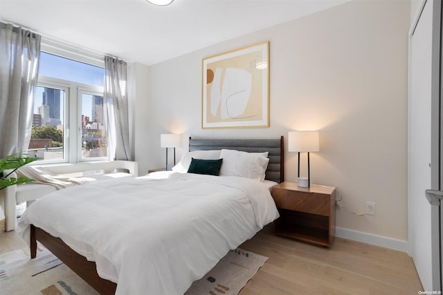 bedroom featuring light wood-type flooring