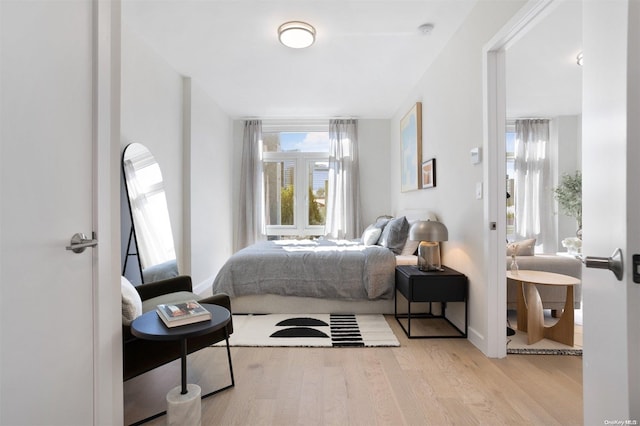 bedroom with light hardwood / wood-style flooring