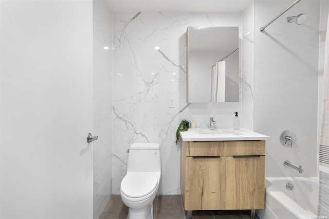 full bathroom featuring shower / tub combo, vanity, toilet, and tile walls