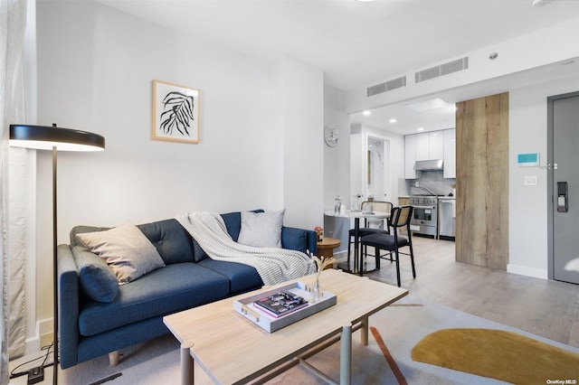 living room with light hardwood / wood-style floors