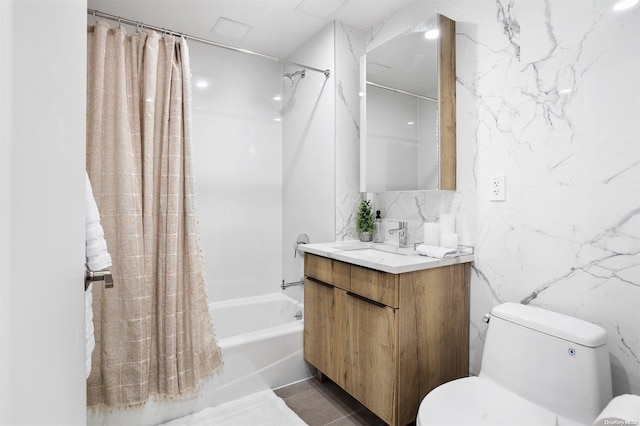 full bathroom with shower / tub combo, vanity, toilet, and tile walls