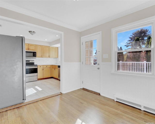 kitchen featuring appliances with stainless steel finishes, light hardwood / wood-style floors, a baseboard radiator, and light brown cabinetry