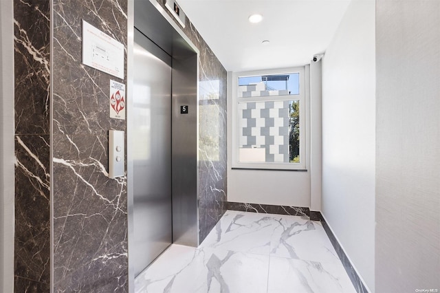28-09 39th Ave Unit 5A, Long Island City, NY 11101 - hallway with marble tiled flooring, baseboards, elevator, and recessed lighting
