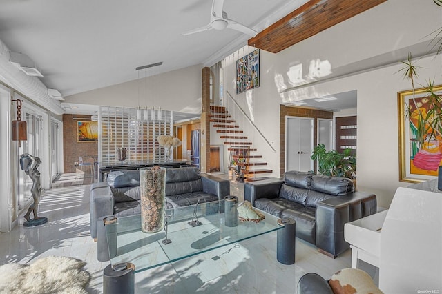 living room with ceiling fan and lofted ceiling