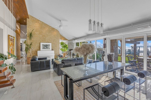 interior space with ceiling fan and vaulted ceiling