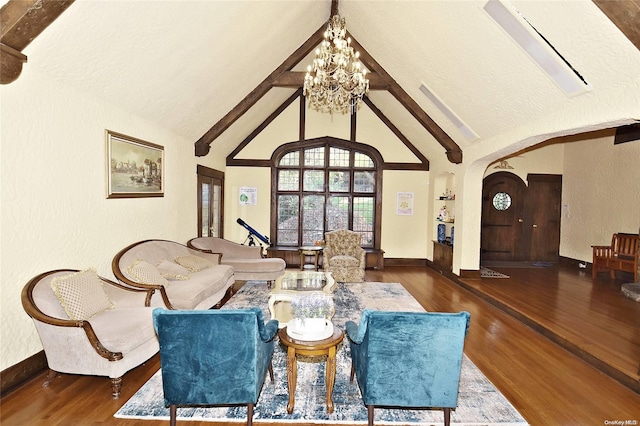 living room with dark hardwood / wood-style flooring, beamed ceiling, high vaulted ceiling, and a notable chandelier