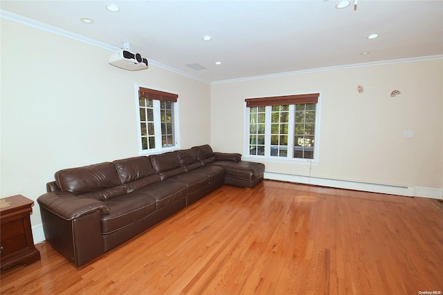 unfurnished living room featuring light hardwood / wood-style floors, baseboard heating, and ornamental molding