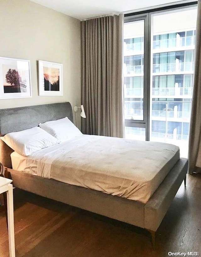 bedroom featuring dark wood-type flooring