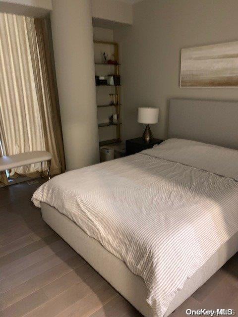 bedroom featuring hardwood / wood-style flooring