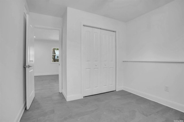 unfurnished bedroom with a closet