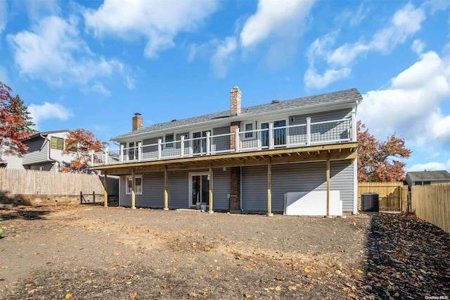 back of house featuring central AC