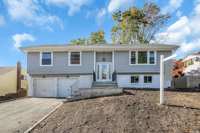 split foyer home featuring a garage