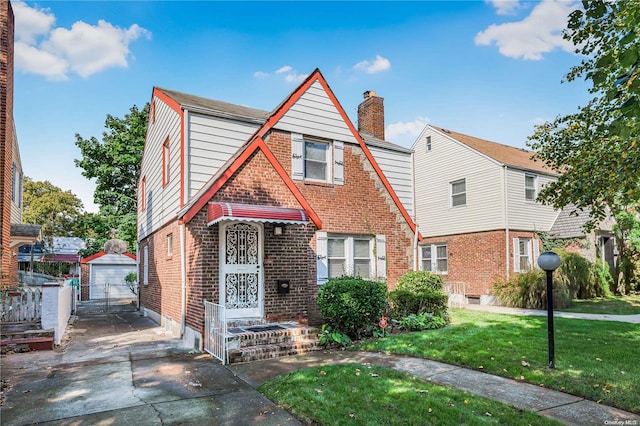 view of front facade with a front yard and a garage