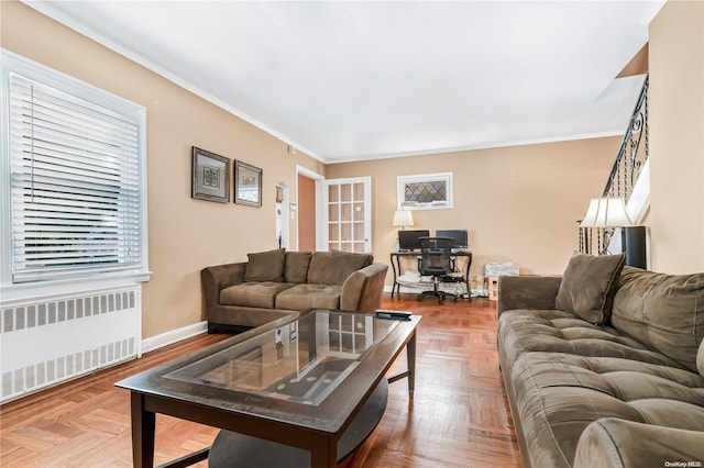 living room featuring radiator, parquet floors, and ornamental molding
