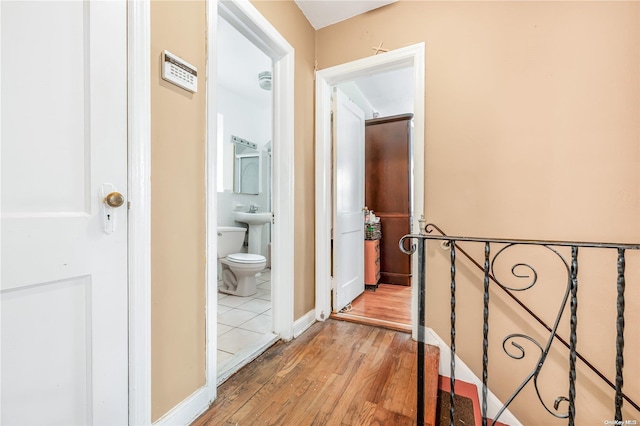 hallway featuring wood-type flooring