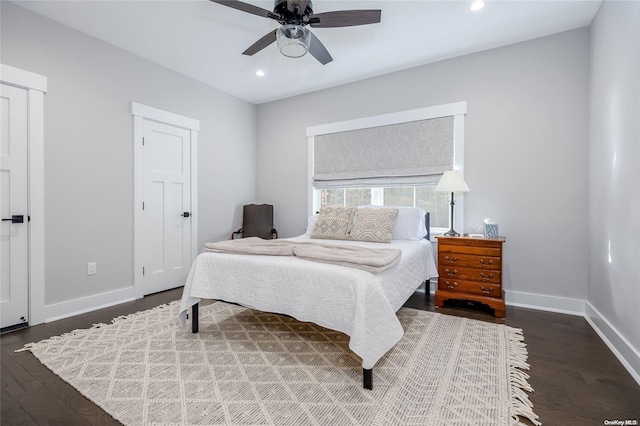 bedroom featuring ceiling fan and dark hardwood / wood-style flooring