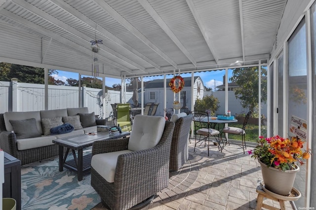 sunroom with beam ceiling