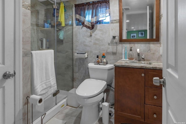 bathroom with tile patterned floors, tile walls, an enclosed shower, and toilet