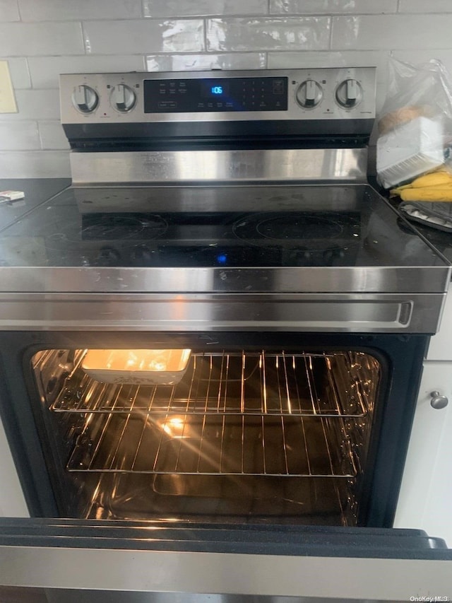 room details featuring stainless steel electric range oven