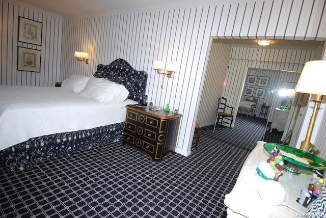 bedroom featuring carpet floors and ornamental molding