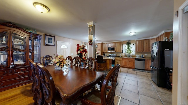 dining room with light tile patterned flooring