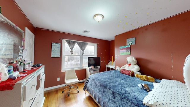 bedroom with light wood-type flooring