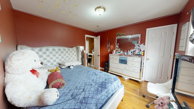 bedroom featuring wood-type flooring