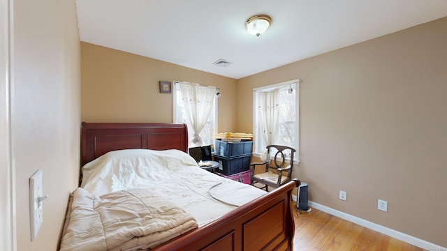 bedroom with light wood-type flooring